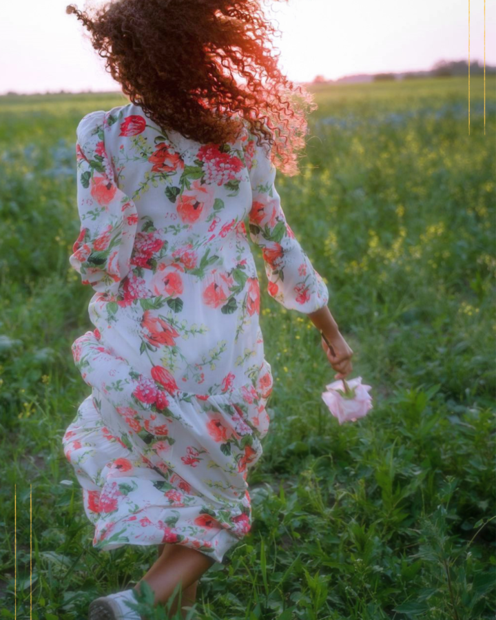 girl running with a flower in her hand