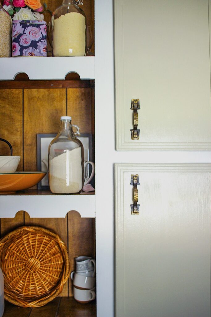 kitchen shelf with stored grain in glass jars