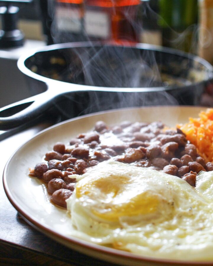 dinner plate with eggs, beans and mexican rice