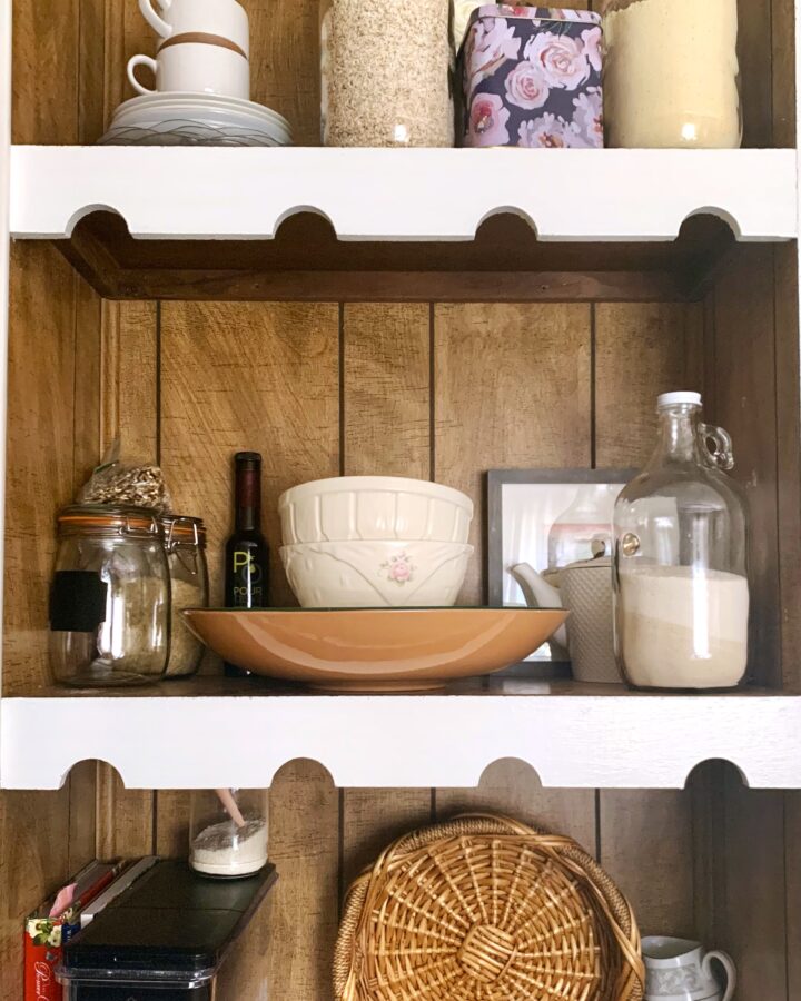 beautiful kitchen shelving with plates and jars as decor