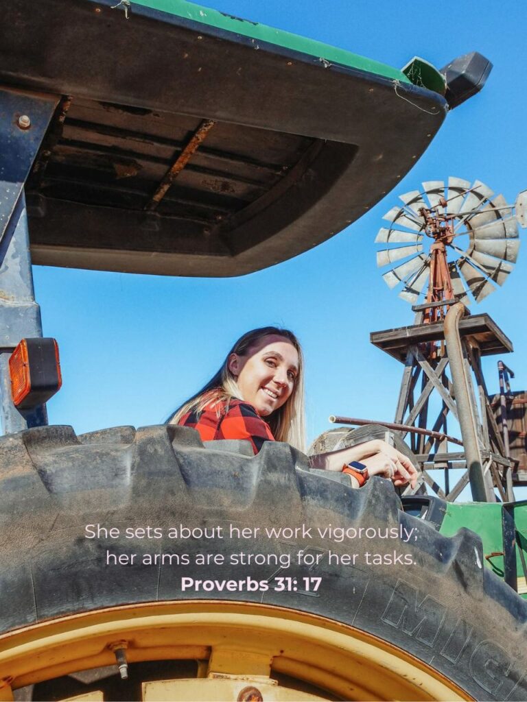 woman working at the farm driving a tractor