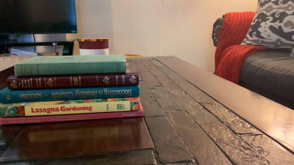 Fall books and cozy orange blanket for Autumn